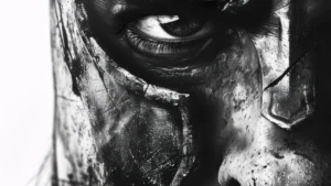 High-contrast black-and-white close-up of a human face partially obscured by dark paint or cracks, one eye sharply visible, conveying damage, endurance, and introspection.