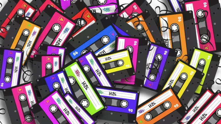 A chaotic pile of colorful cassette tapes scattered and overlapping, representing analog media and fragmented memory.